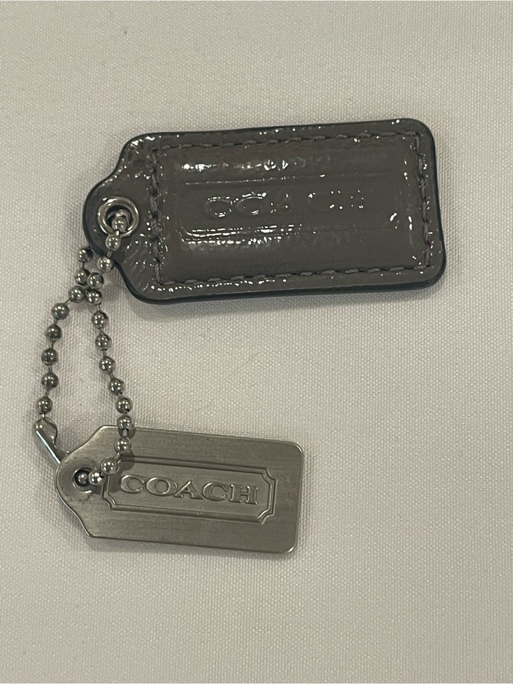 Coach Grey Patent Leather and Silver Metal Dog Tag Keychain